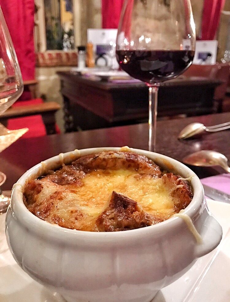 Heartwarming French Onion Soup with Cheese at Au Vieux Paris D'Arcole