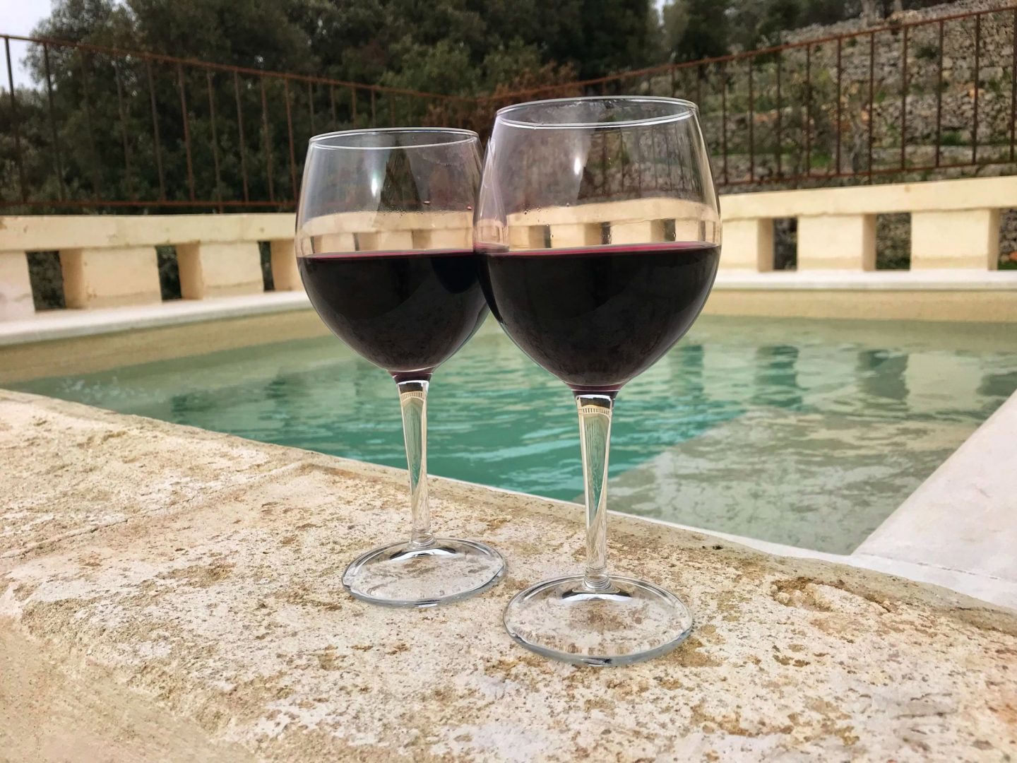 Red wine by the hot tub at Corte dei Massapi villa
