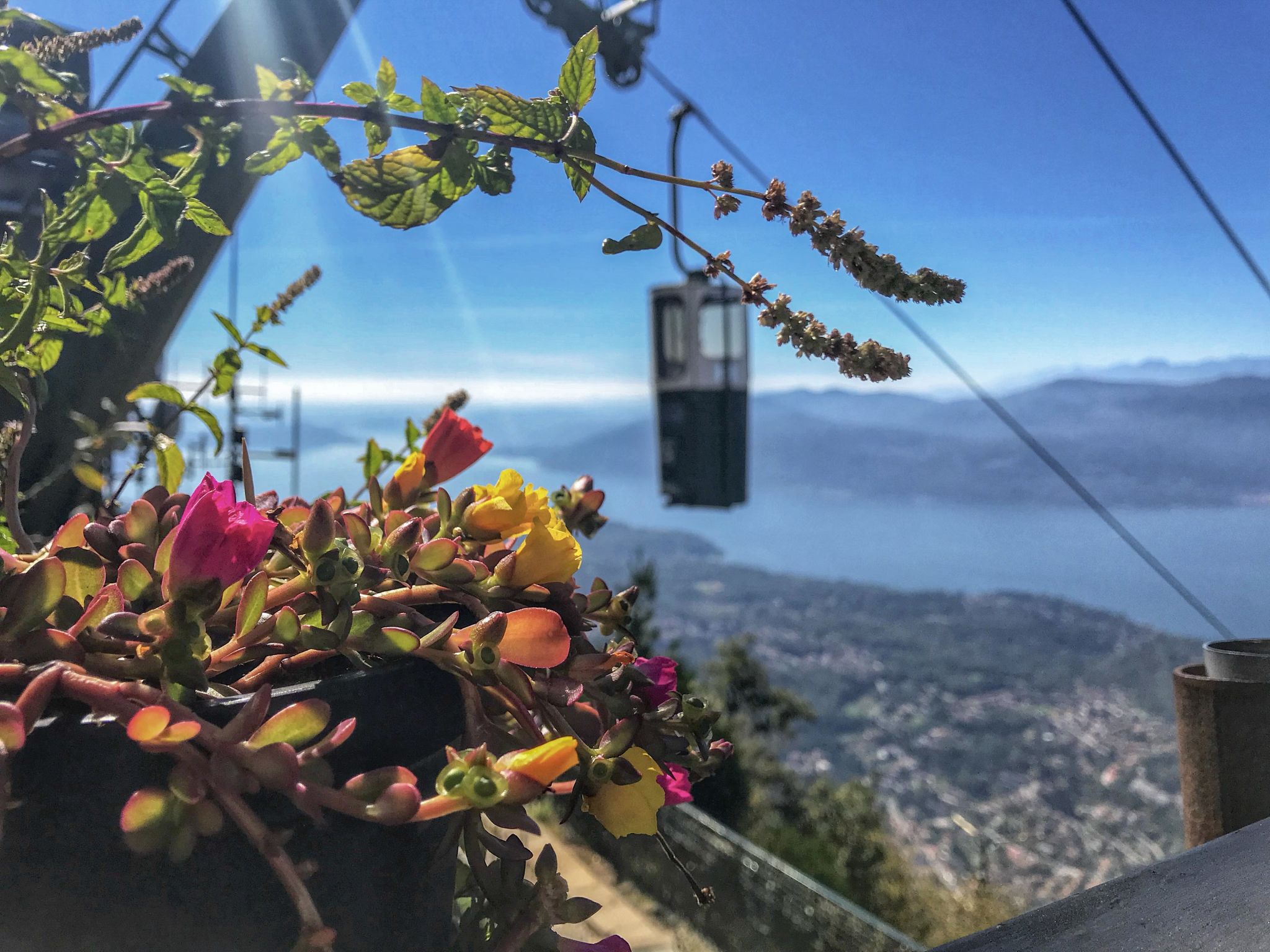 Pretty views overlooking the closed-top bucket lift cable car of Lake Maggiore