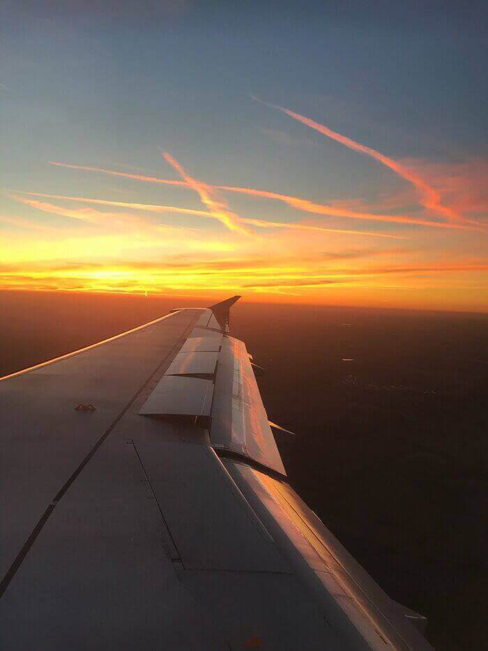 Plane window sunset view