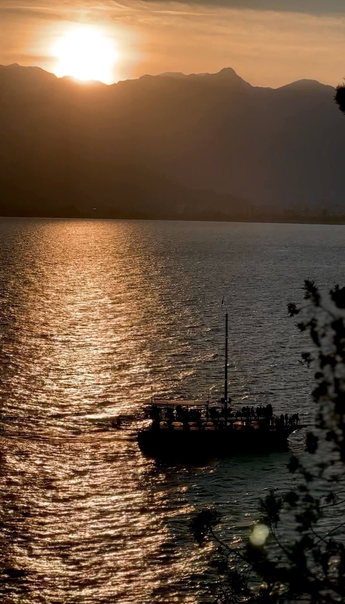 Boat-Sailing-at-Sunset-Antalya-Old-Town